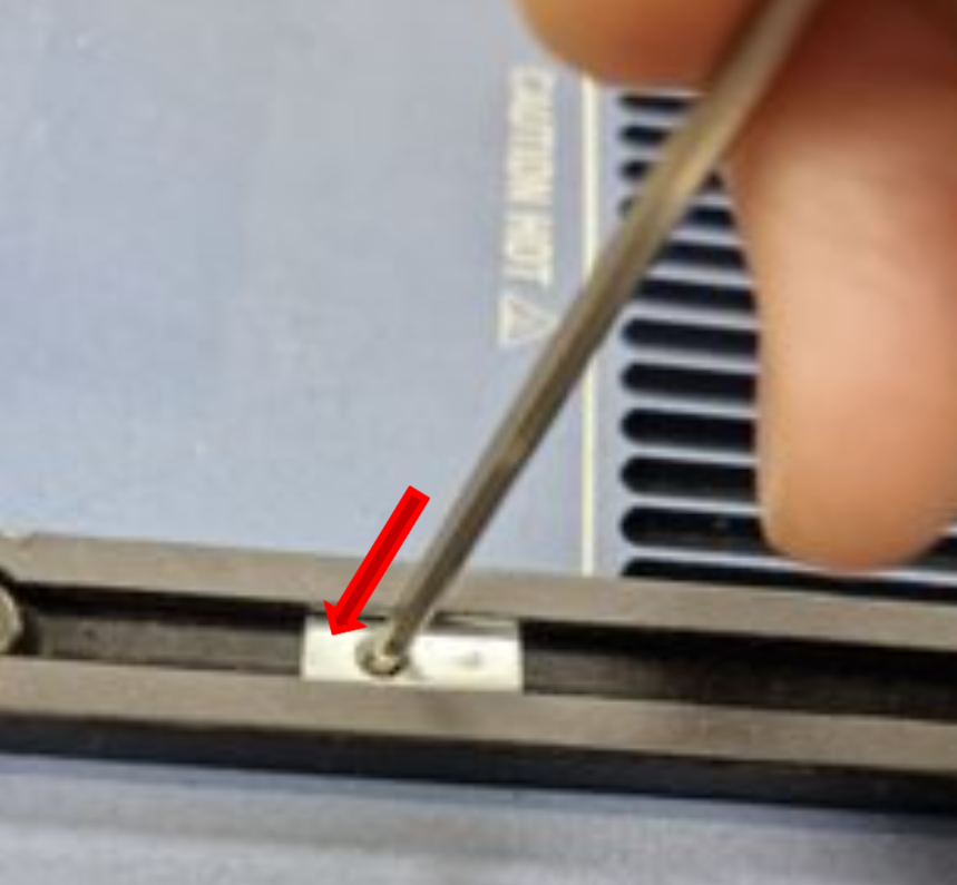 Insert rod into spring nut hole